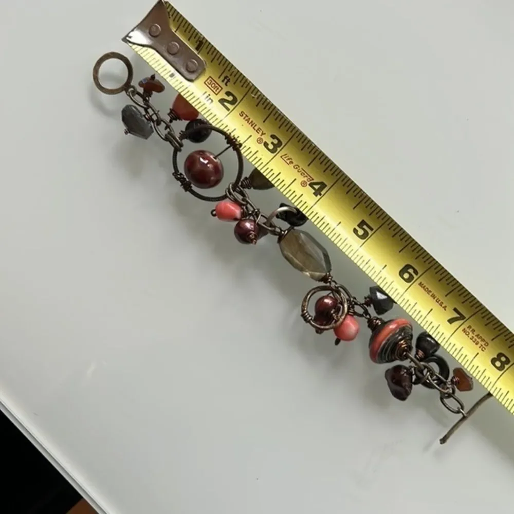 Artistic bracelet with wire wrapped stones.